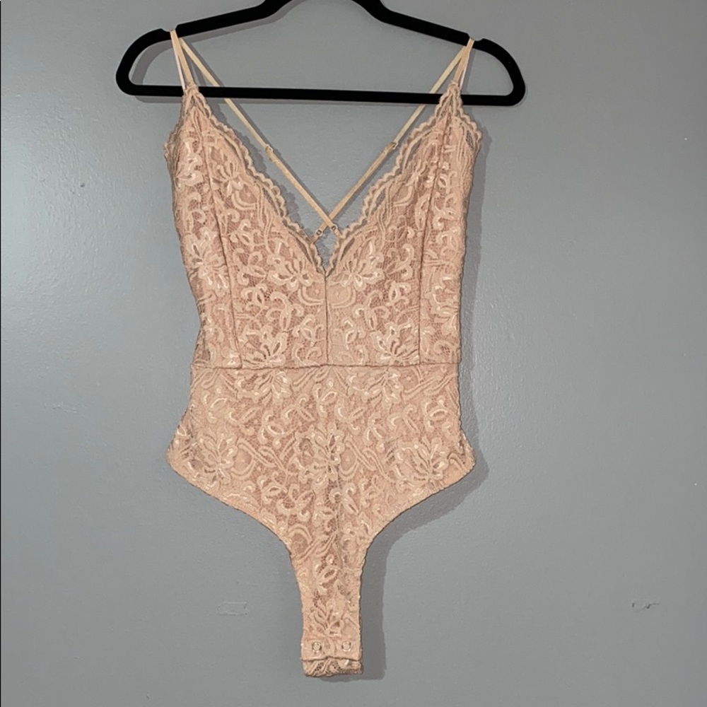 Blush pink body suit. Never worn